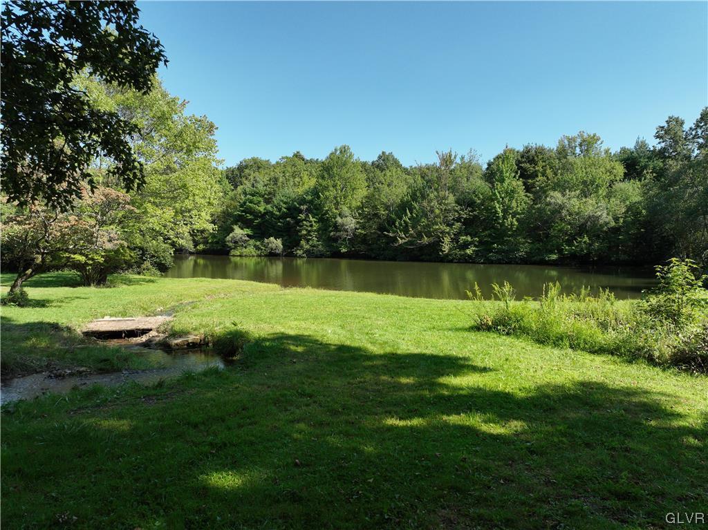 234 Rinker Road Stroudsburg, PA 18360 - Photo 41 of 49 a view of a lake with houses in the background