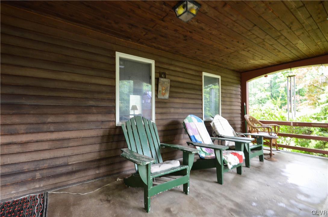 234 Rinker Road Stroudsburg, PA 18360 - Photo 46 of 49 a view of a chairs and table in patio with a backyard