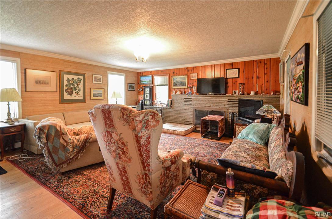 234 Rinker Road Stroudsburg, PA 18360 - Photo 7 of 49 a living room with furniture and a flat screen tv