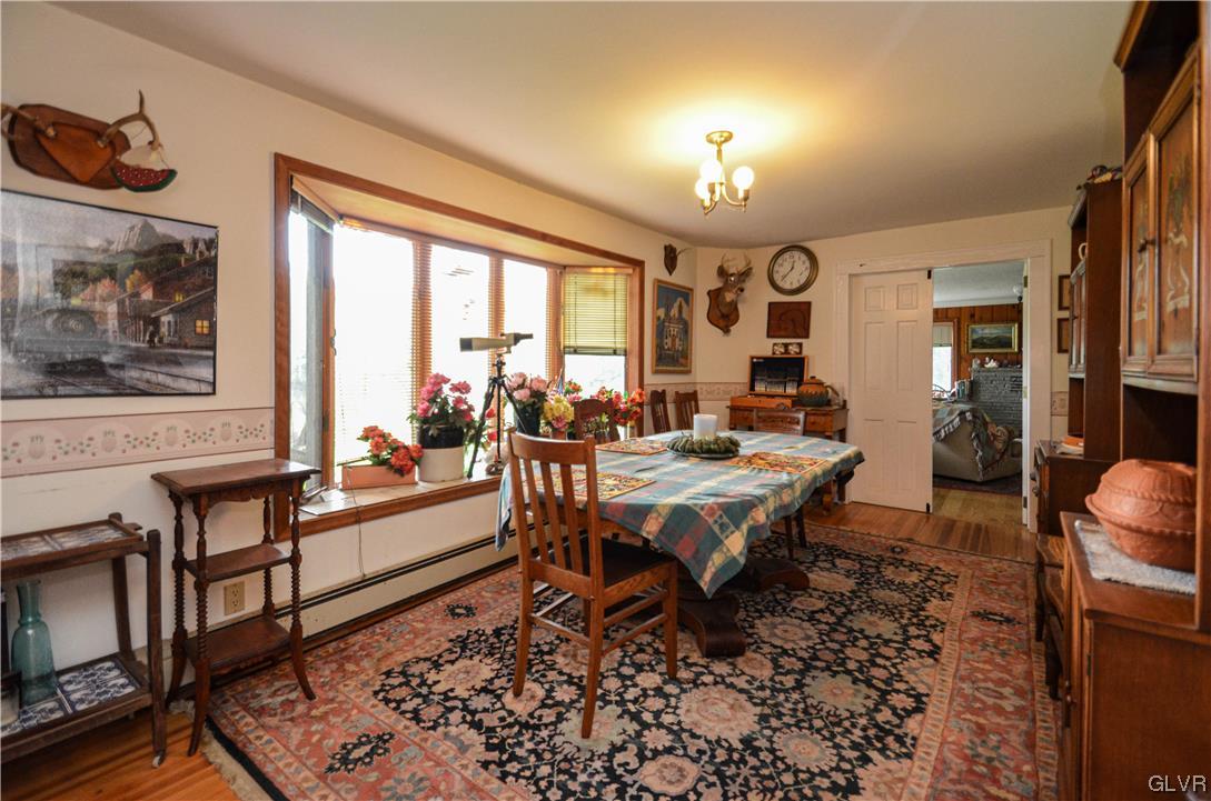 234 Rinker Road Stroudsburg, PA 18360 - Photo 10 of 49 a living room with furniture a rug and a large window