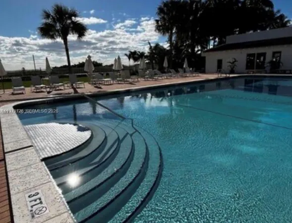 a view of a swimming pool with a patio