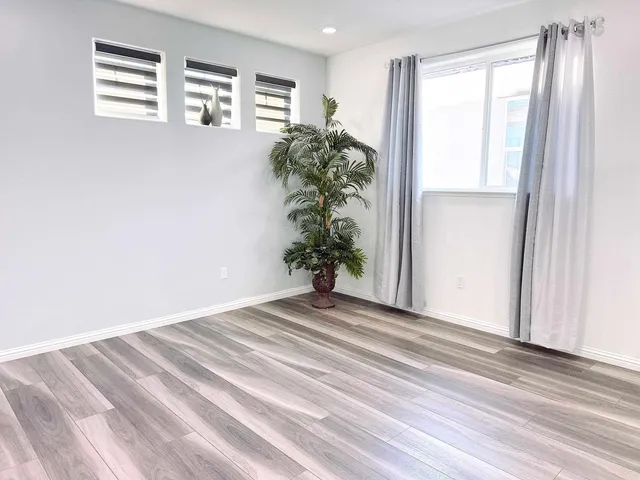 a bathroom with a bathtub shower and a sink