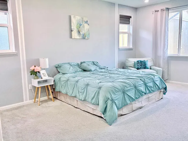 a bathroom with a double vanity sink a mirror and a shower