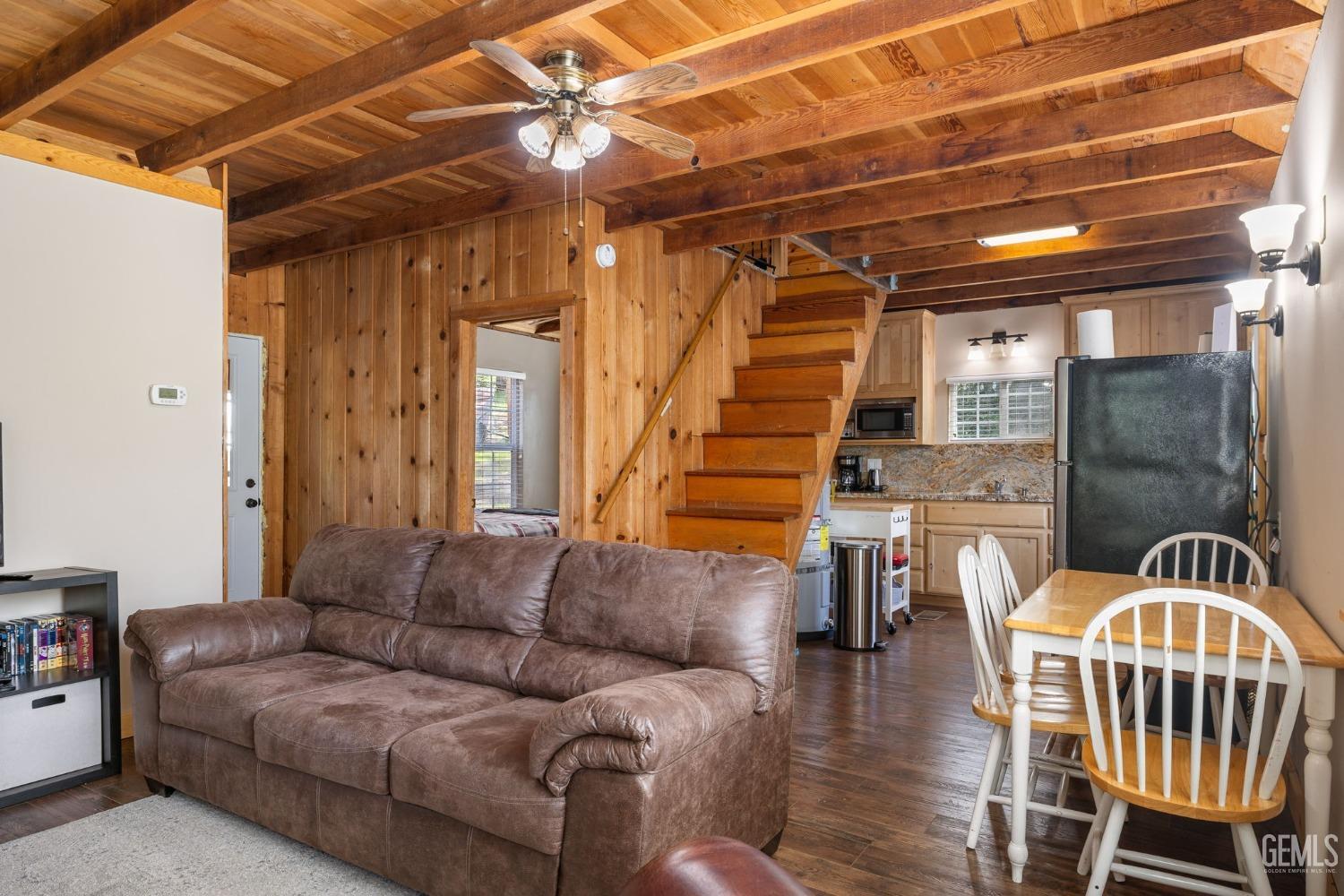Undisclosed Address Posey, CA 93260 - Photo 17 of 53 a living room with furniture and a chandelier