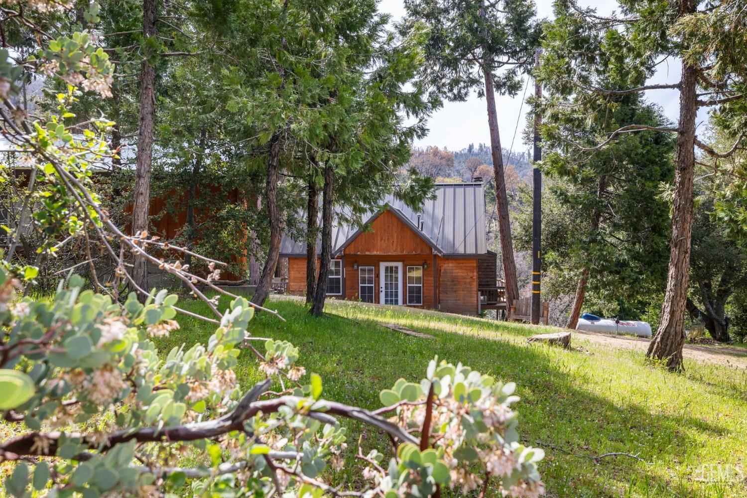 Undisclosed Address Posey, CA 93260 - Photo 2 of 53 a view of a house with a yard