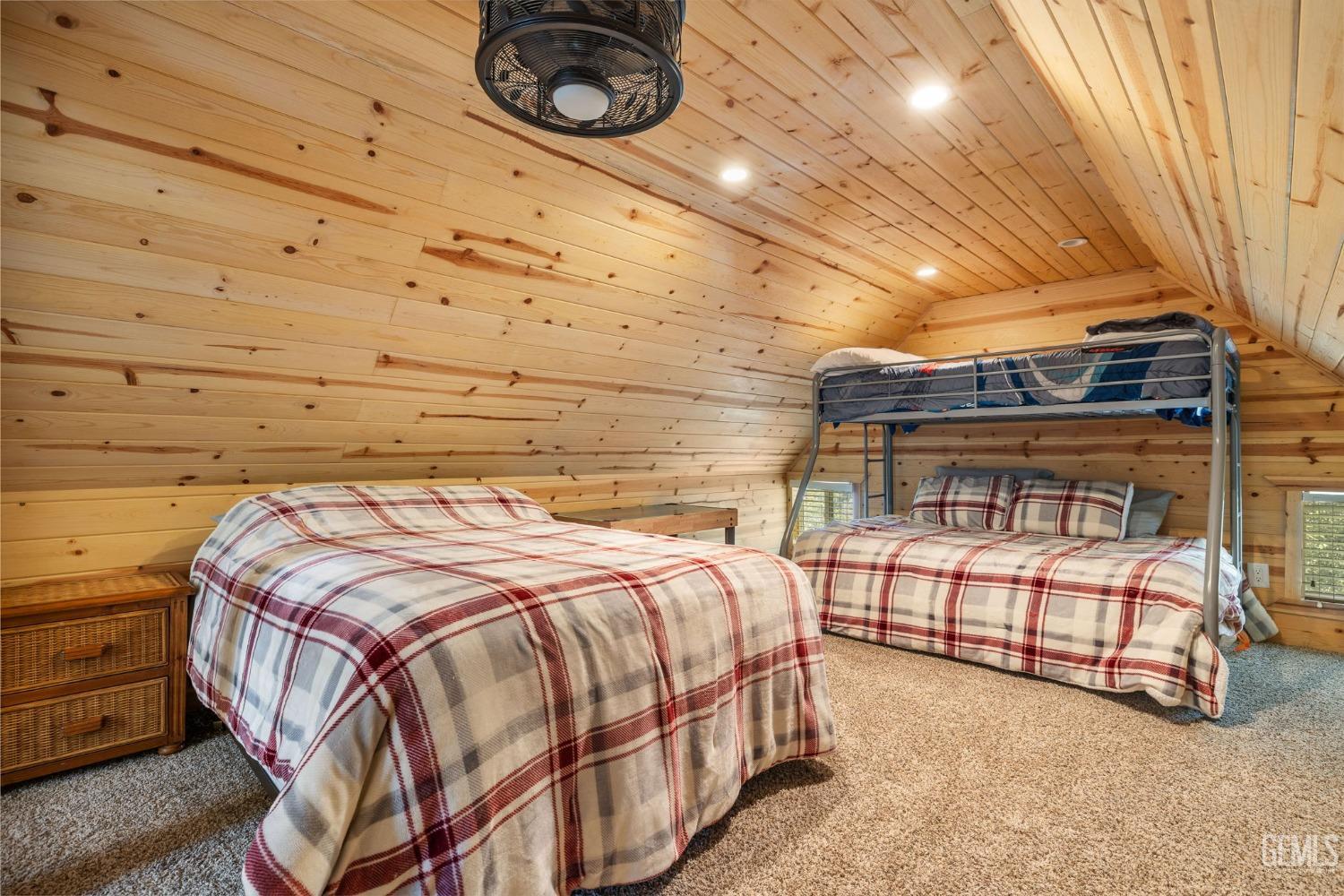 Undisclosed Address Posey, CA 93260 - Photo 32 of 53 a bed sitting in a room next to a lamp