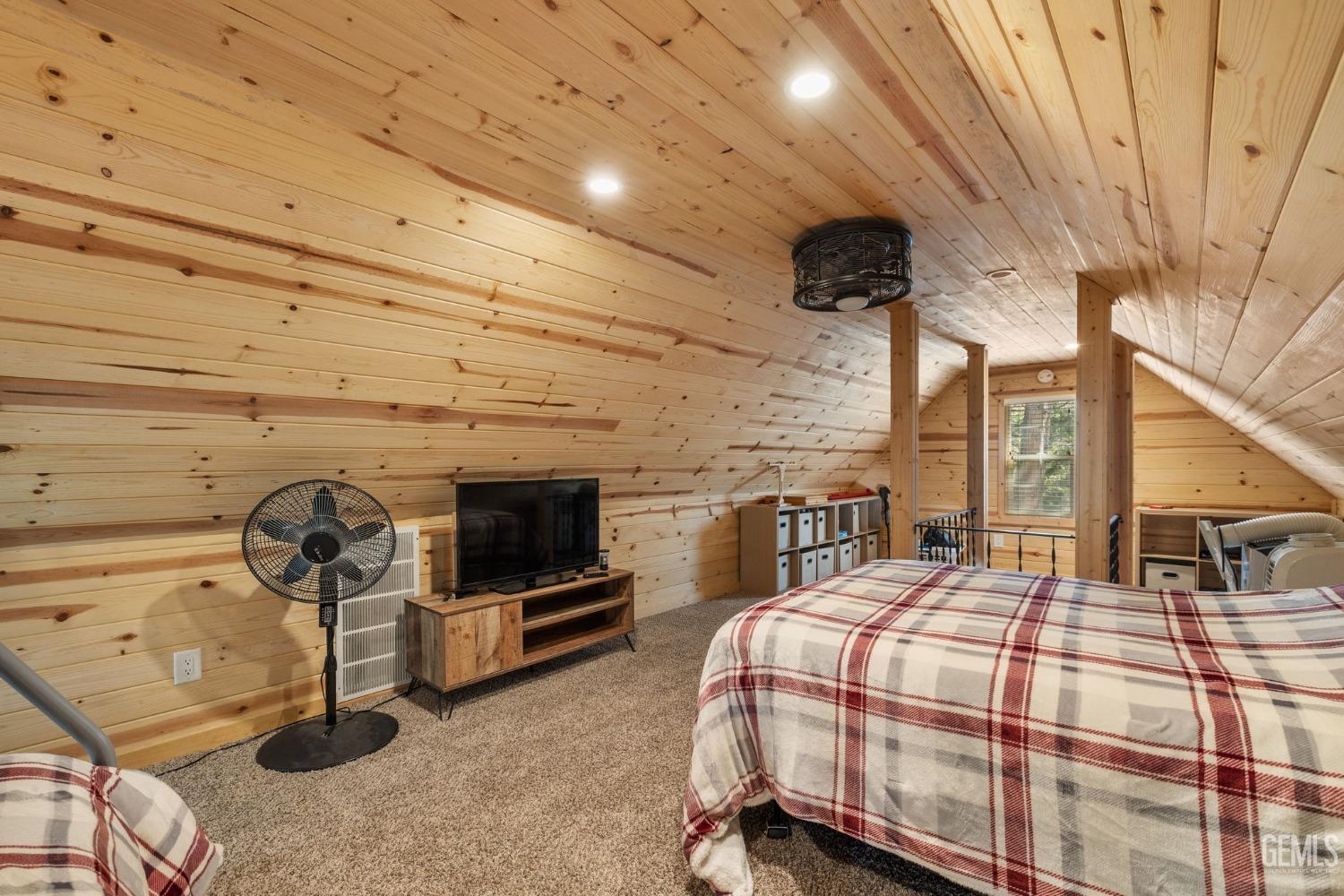 Undisclosed Address Posey, CA 93260 - Photo 34 of 53 a bedroom with a bed and a chandelier