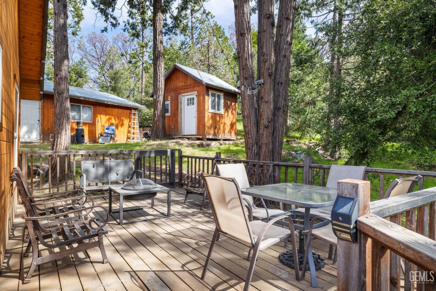 Undisclosed Address Posey, CA 93260 - Photo 35 of 53 a view of a patio with a table chairs and backyard