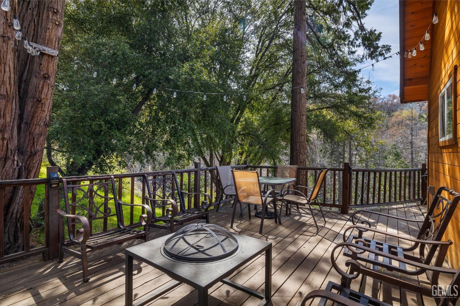 Undisclosed Address Posey, CA 93260 - Photo 36 of 53 a view of a balcony with chairs and wooden fence