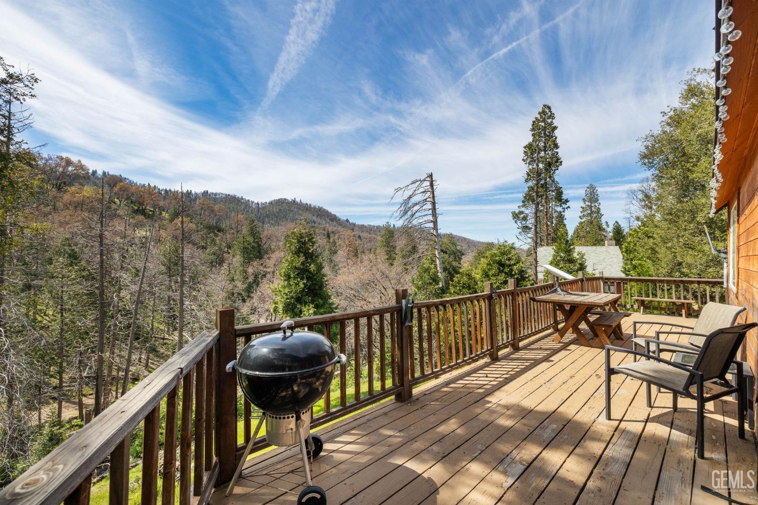 Undisclosed Address Posey, CA 93260 - Photo 37 of 53 a view of a balcony with mountain view and wooden floor