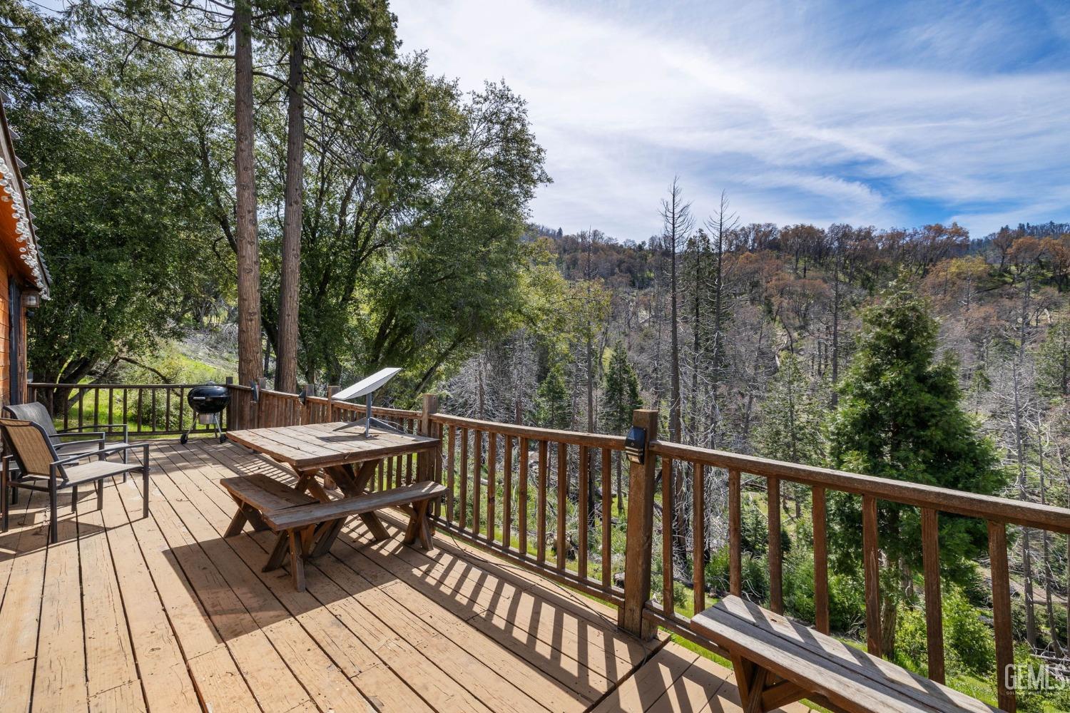 Undisclosed Address Posey, CA 93260 - Photo 38 of 53 a view of a balcony with wooden floor and outdoor seating