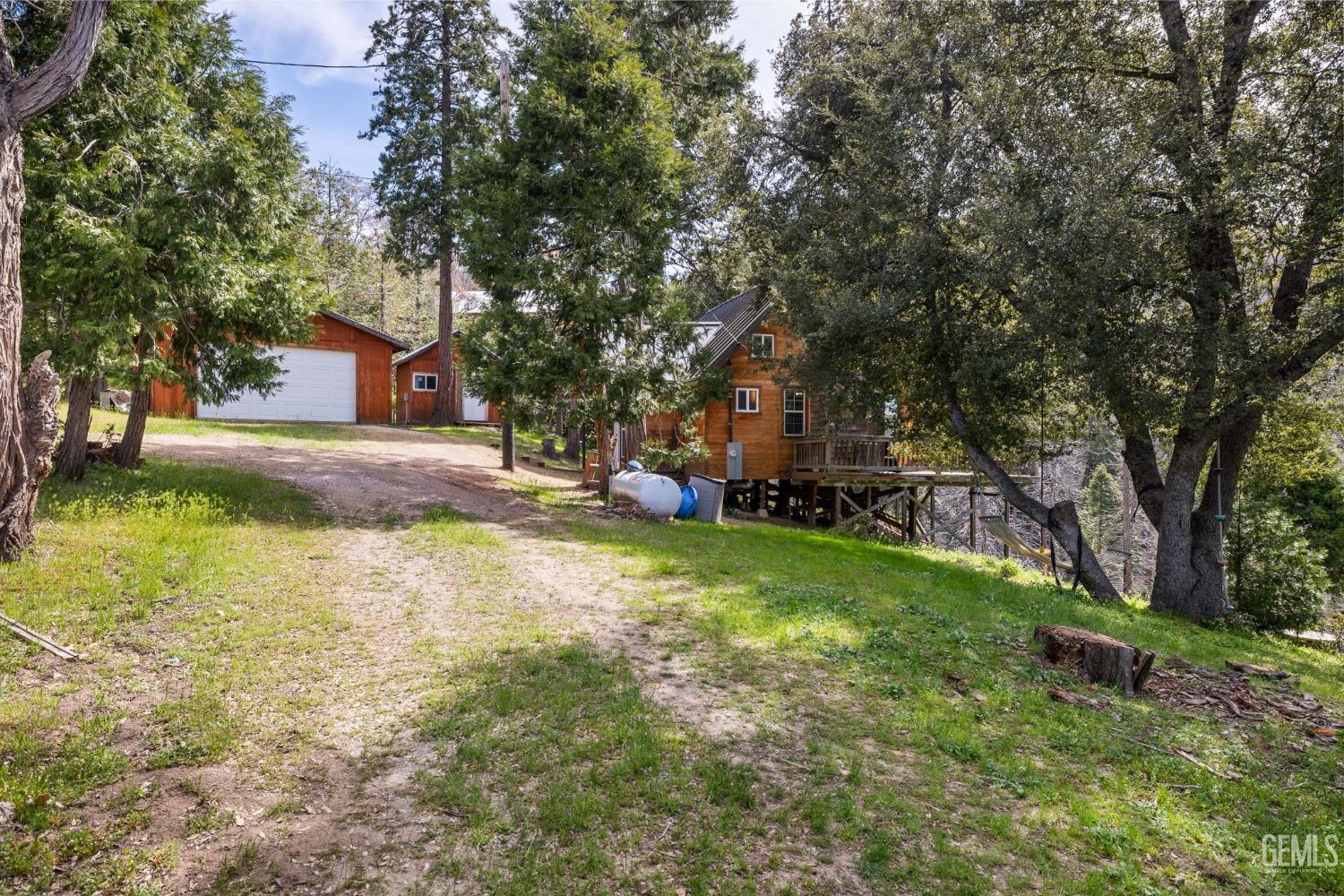 Undisclosed Address Posey, CA 93260 - Photo 40 of 53 a view of a house with a yard
