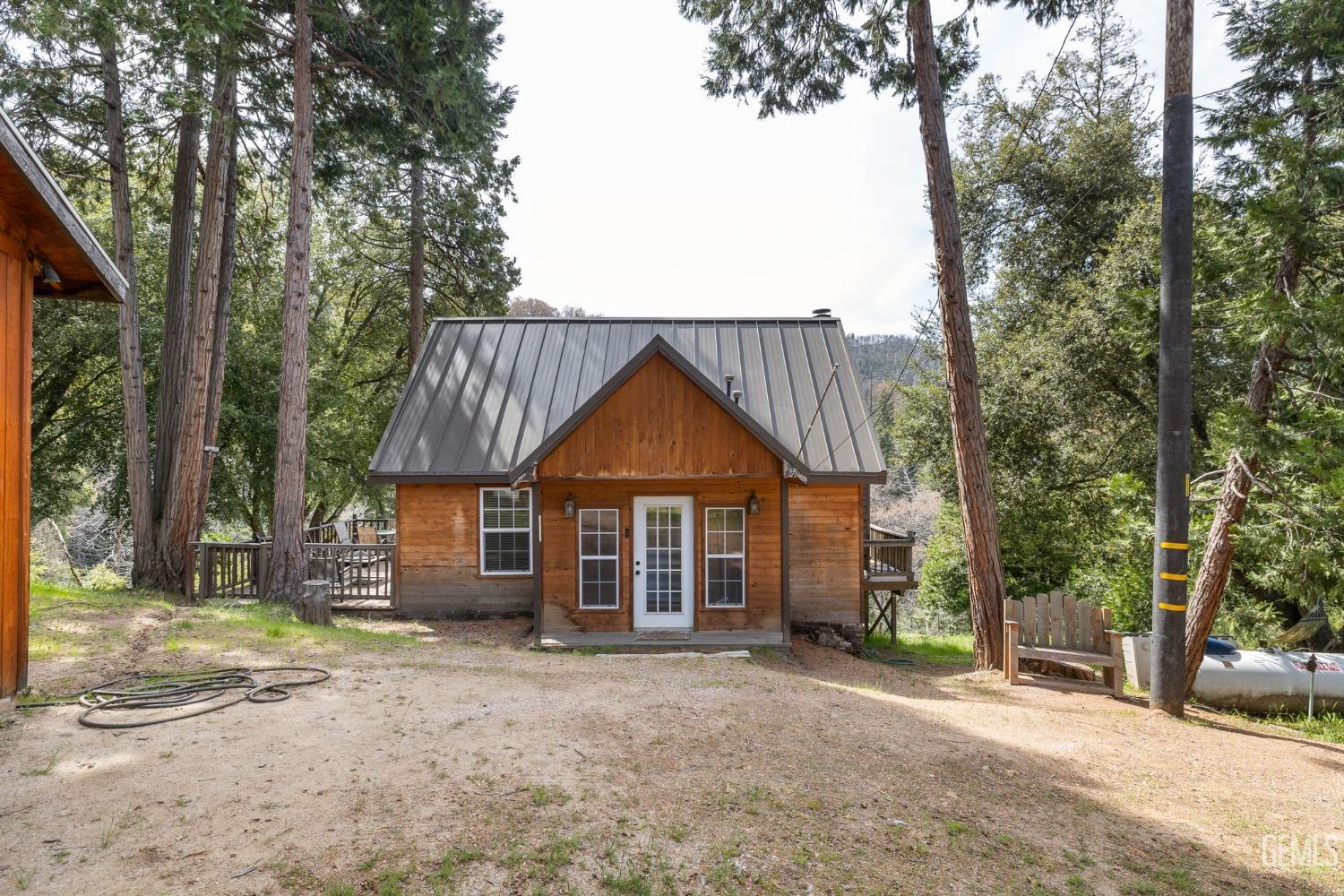 Undisclosed Address Posey, CA 93260 - Photo 4 of 53 a front view of a house with a garden