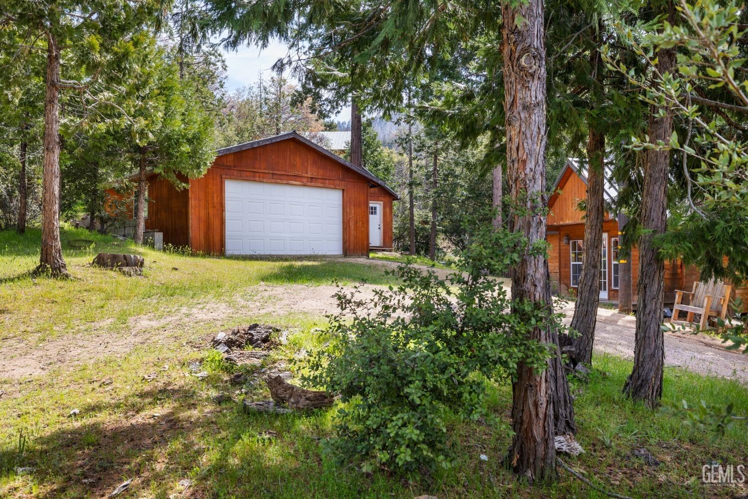Undisclosed Address Posey, CA 93260 - Photo 43 of 53 a backyard of a house with lots of green space