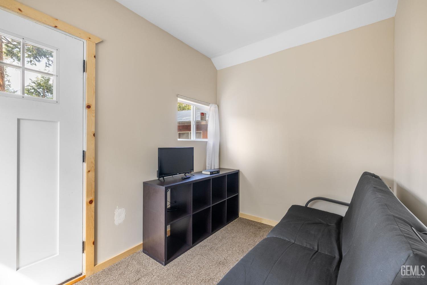 Undisclosed Address Posey, CA 93260 - Photo 47 of 53 a living room with furniture and a flat screen tv