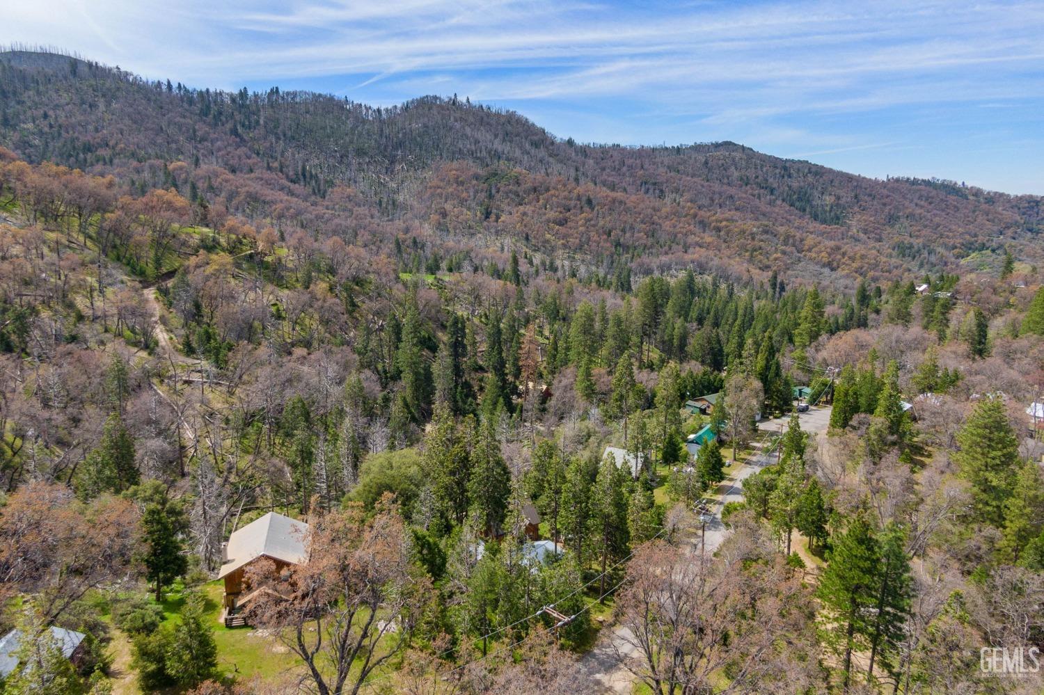 Undisclosed Address Posey, CA 93260 - Photo 50 of 53 an aerial view of mountain with residential house and green field
