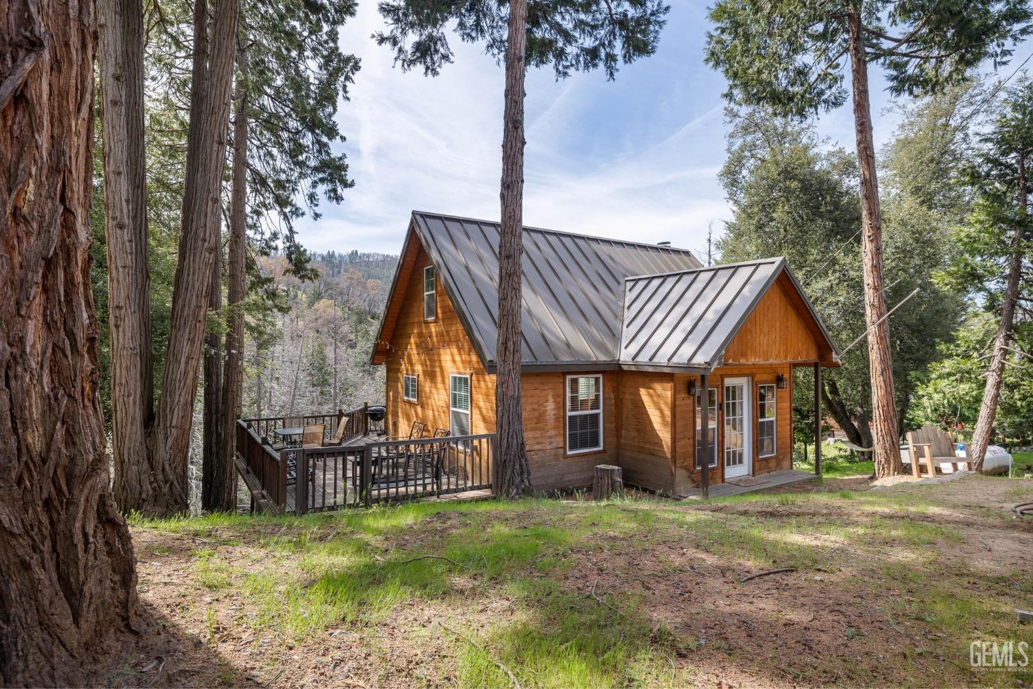 Undisclosed Address Posey, CA 93260 - Photo 5 of 53 a view of a house with backyard and trees