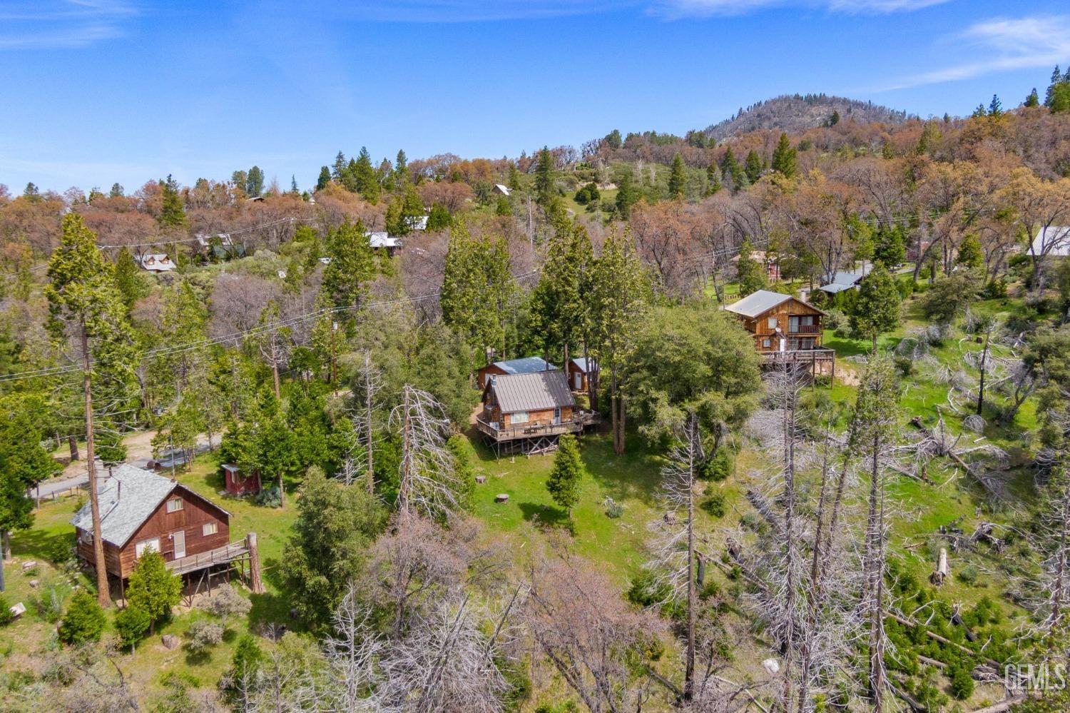 Undisclosed Address Posey, CA 93260 - Photo 51 of 53 an aerial view of a house with a yard basket ball court and outdoor seating