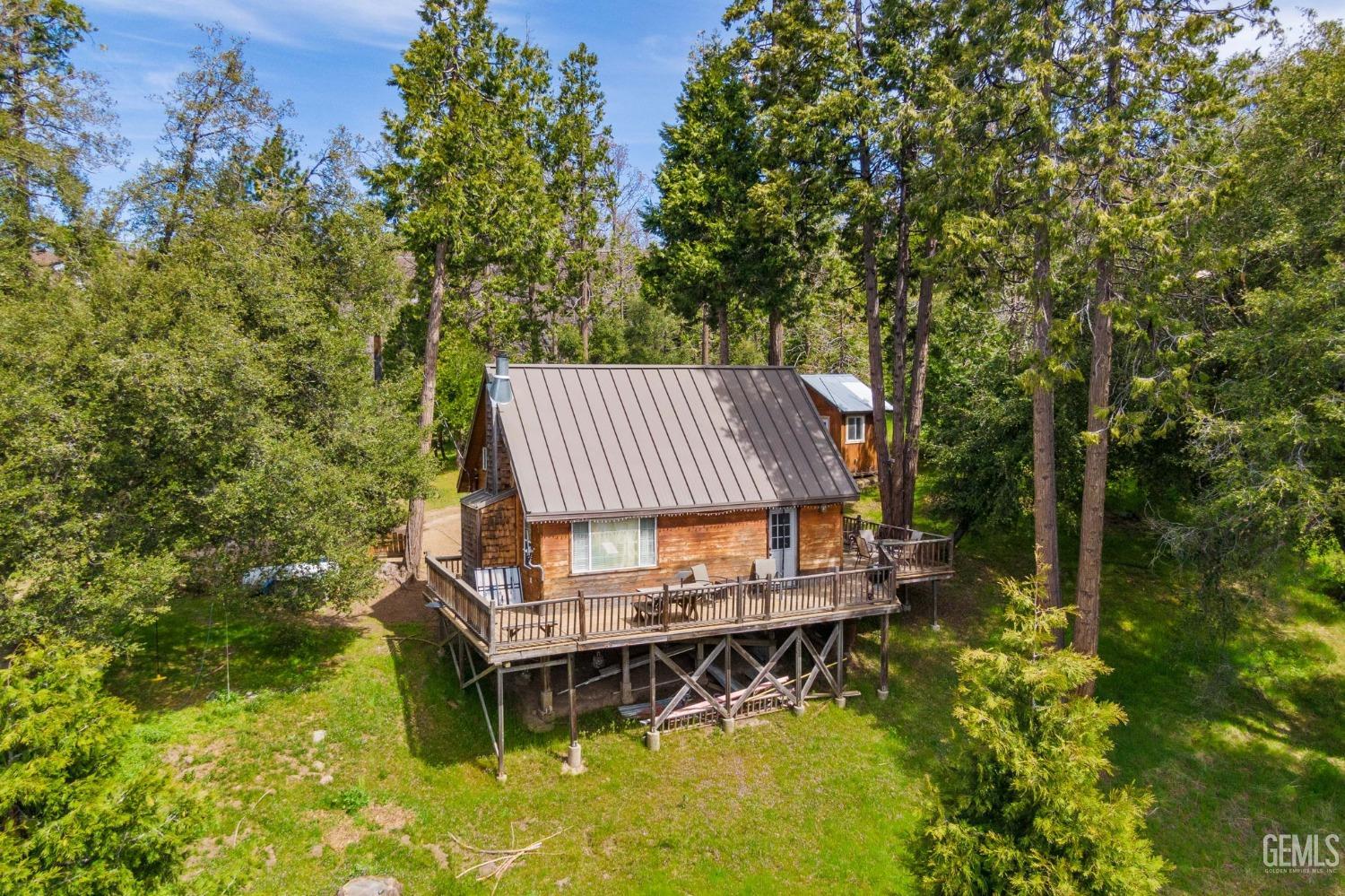 Undisclosed Address Posey, CA 93260 - Photo 52 of 53 a small pool with a trees in the background
