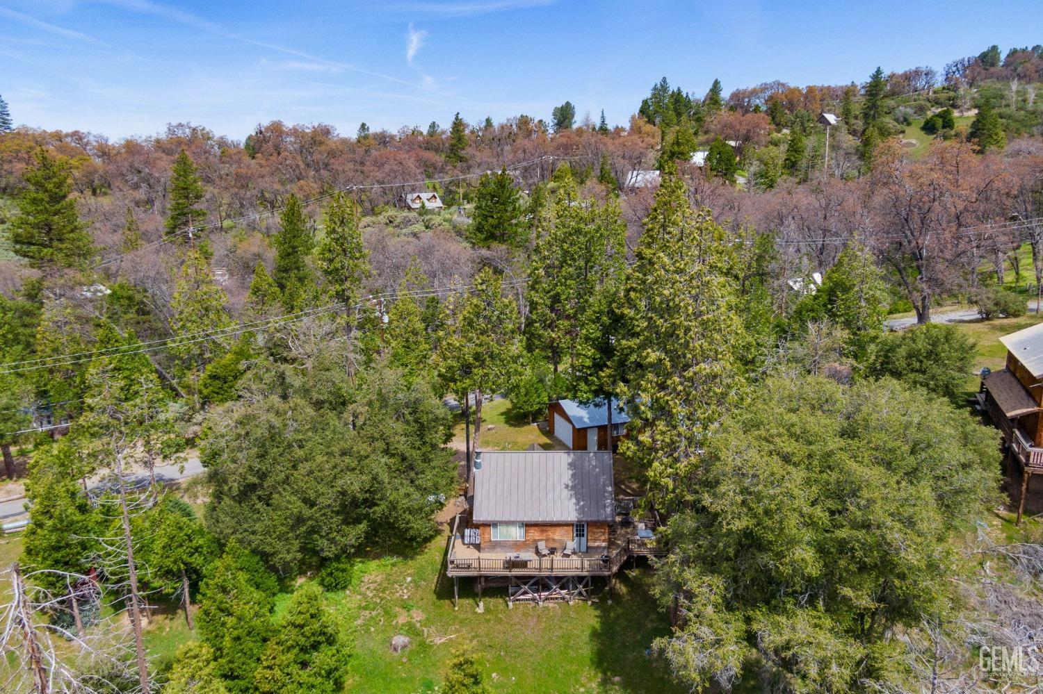 Undisclosed Address Posey, CA 93260 - Photo 53 of 53 an aerial view of a house with mountain view