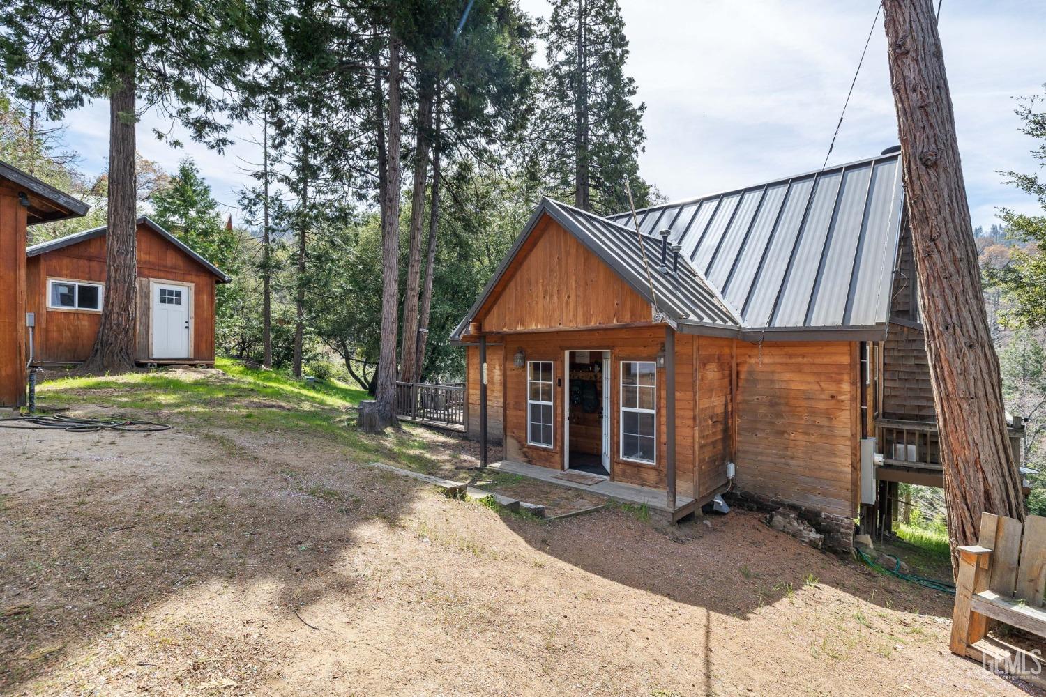 Undisclosed Address Posey, CA 93260 - Photo 6 of 53 a view of a house with a yard