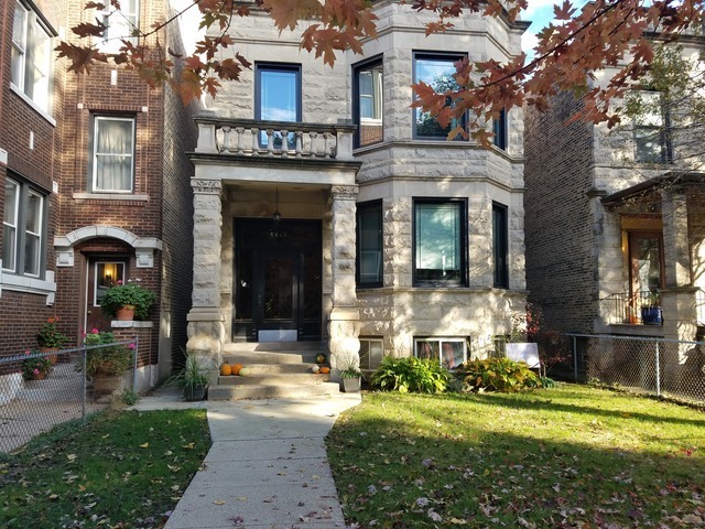 4817 North Winchester Avenue, Unit 2 Chicago, IL 60640 - Photo 1 of 9 a front view of a house with a yard table and chairs