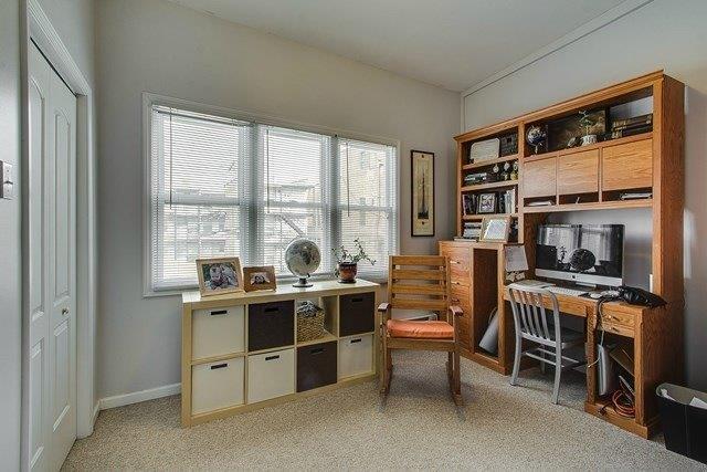 4817 North Winchester Avenue, Unit 2 Chicago, IL 60640 - Photo 5 of 9 a room with stainless steel appliances a stove a sink and a refrigerator