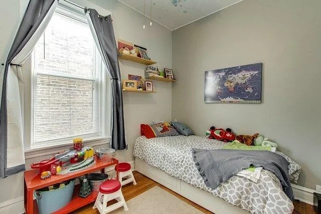 a bedroom with a bed and window