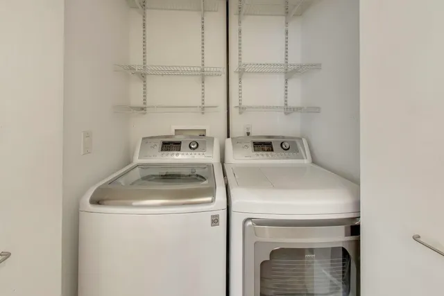 a view of a patio with couches table and chairs and potted plants