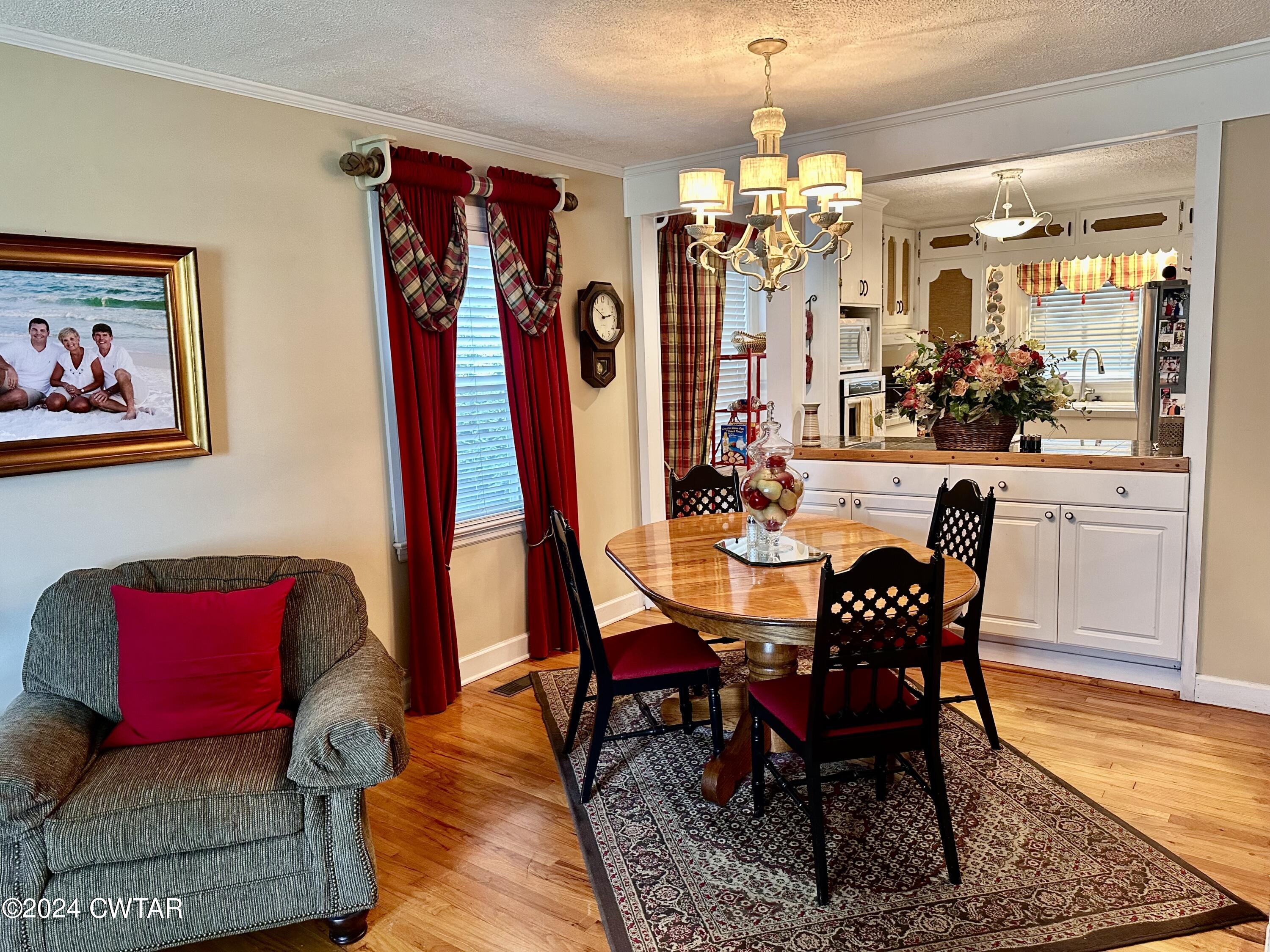 711 South Main Street Ridgely, TN 38080 - Photo 8 of 15 a view of a dining room with furniture wooden floor and a chandelier