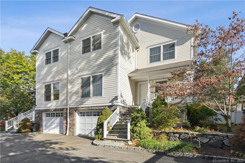 44 Valley Road, Unit C Greenwich, CT 06807 - Photo 1 of 1 a front view of a house with a yard