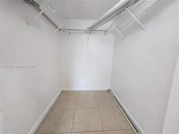 a view of a room with racks on the wall
