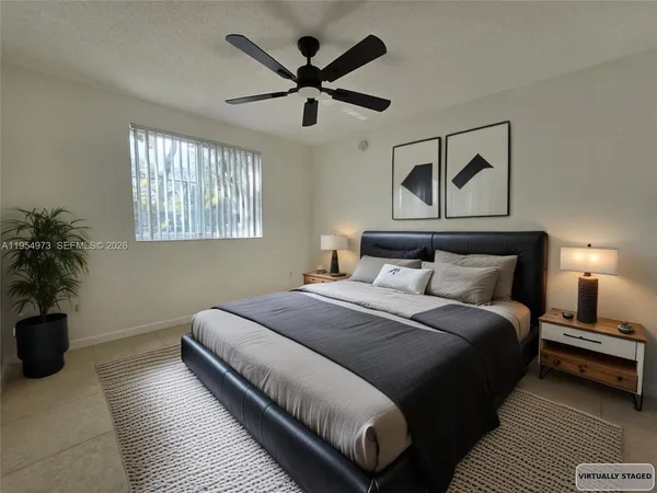 a bedroom with bed and window
