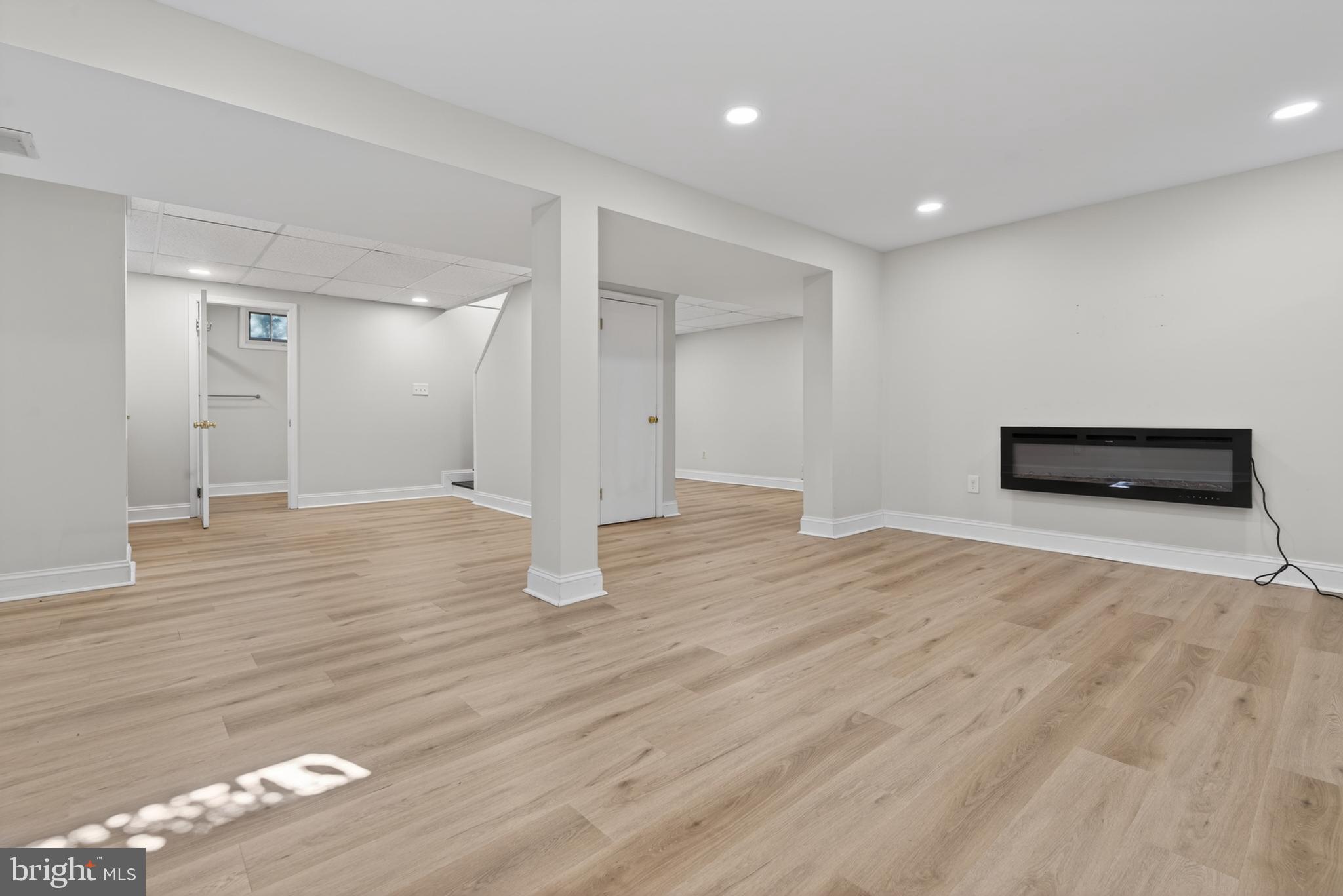 2108 Oak Lodge Road Baltimore, MD 21228 - Photo 22 of 41 Lower level renovated in 2023. Electric fireplace.