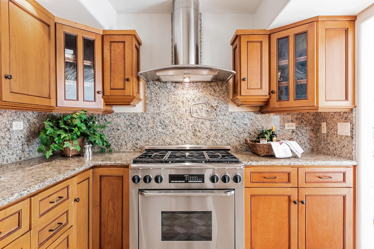 26335 Rio Avenue Carmel, CA 93923 - Photo 17 of 56 a stove top oven sitting inside of a kitchen
