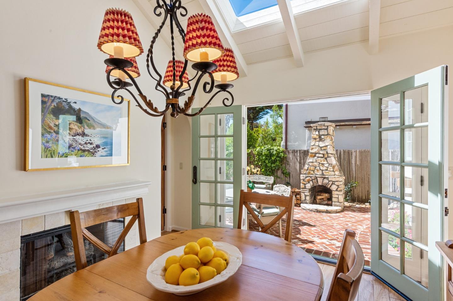 26335 Rio Avenue Carmel, CA 93923 - Photo 24 of 56 a view of a dining room with furniture wooden floor and a chandelier