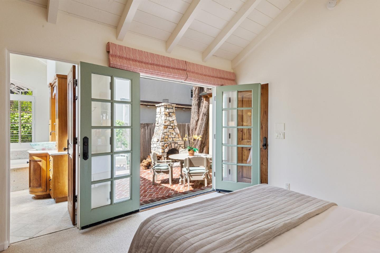 26335 Rio Avenue Carmel, CA 93923 - Photo 30 of 56 a bedroom with a bed and a cabinets