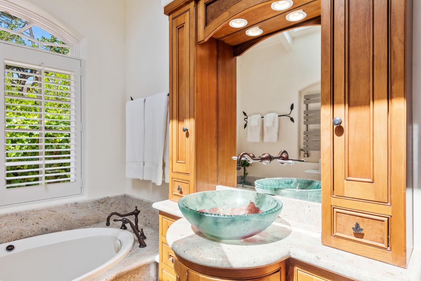 26335 Rio Avenue Carmel, CA 93923 - Photo 32 of 56 a bathroom with a tub and sink