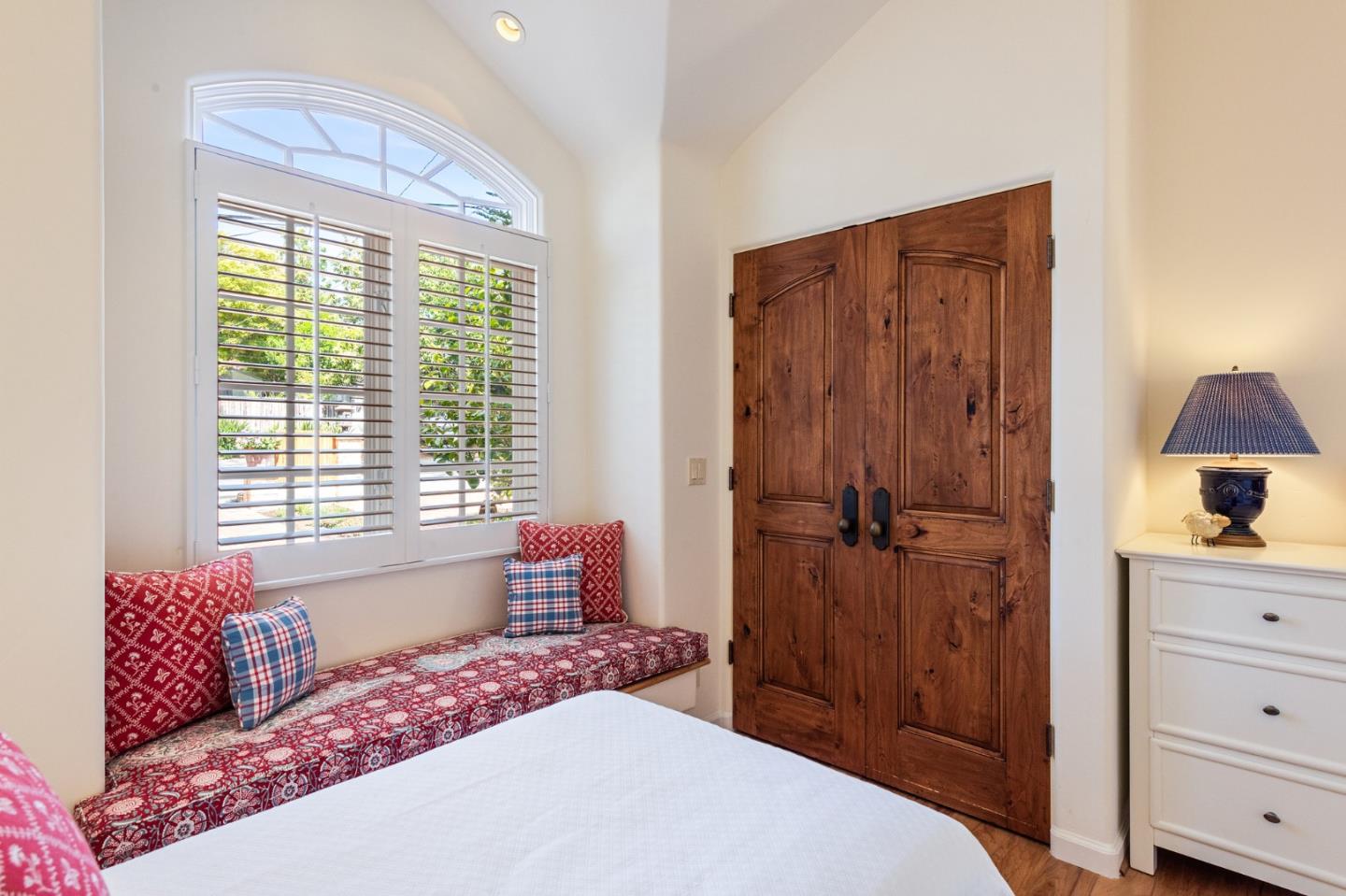 26335 Rio Avenue Carmel, CA 93923 - Photo 35 of 56 a bedroom with a bed and a window