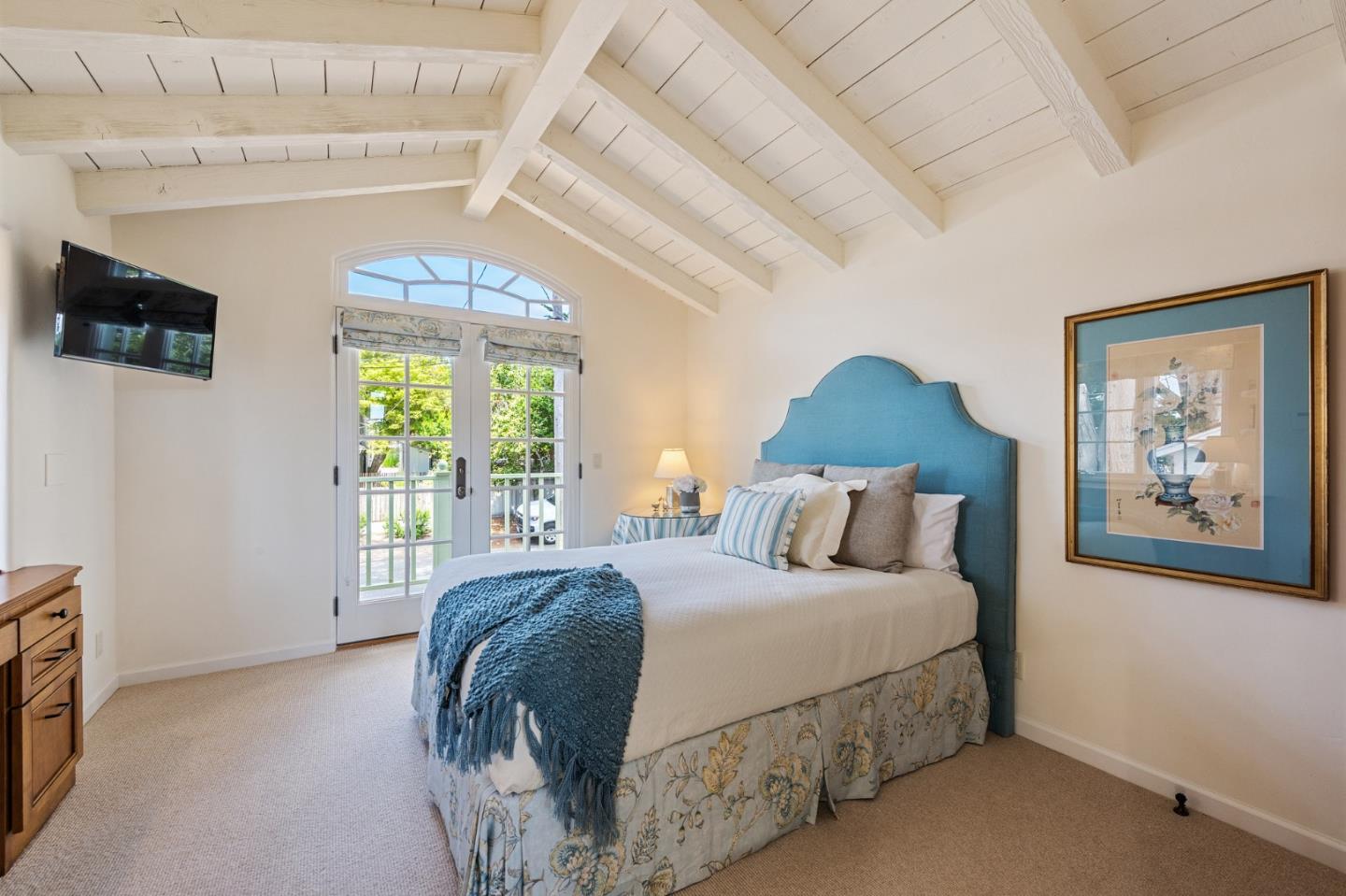 26335 Rio Avenue Carmel, CA 93923 - Photo 37 of 56 a bedroom with a large bed and a window