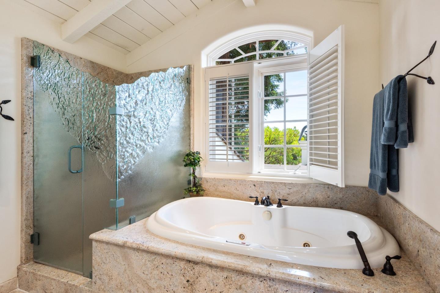 26335 Rio Avenue Carmel, CA 93923 - Photo 41 of 56 a bathroom with a tub a window and a shower