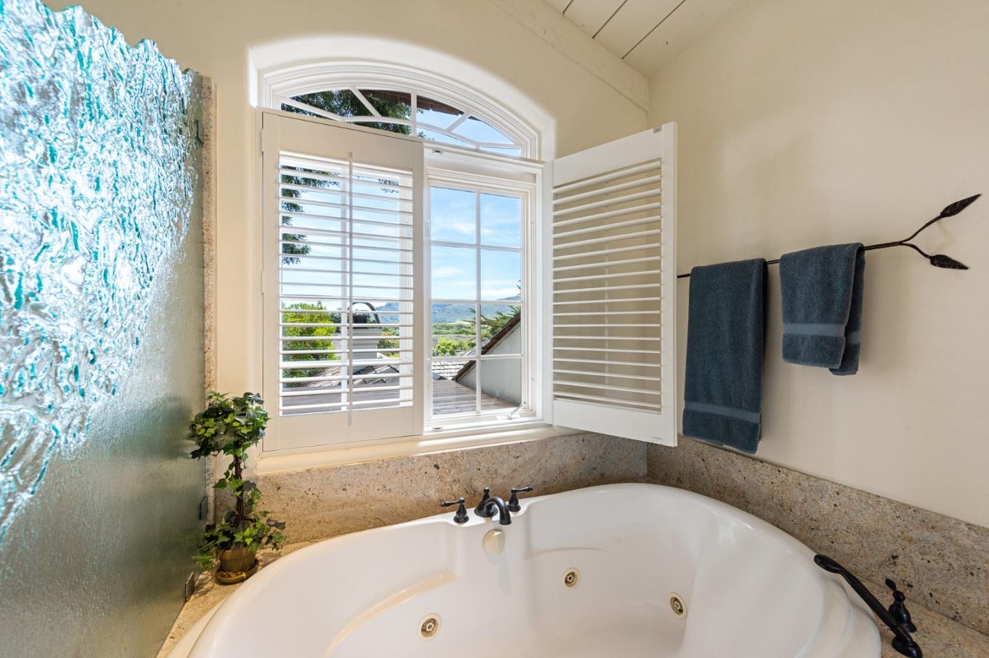 26335 Rio Avenue Carmel, CA 93923 - Photo 43 of 56 a bathroom with a tub and a sink