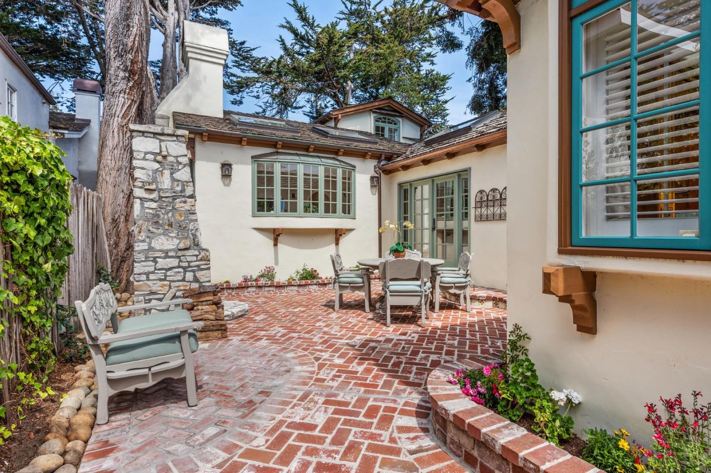 26335 Rio Avenue Carmel, CA 93923 - Photo 50 of 56 a backyard of a house with outdoor seating