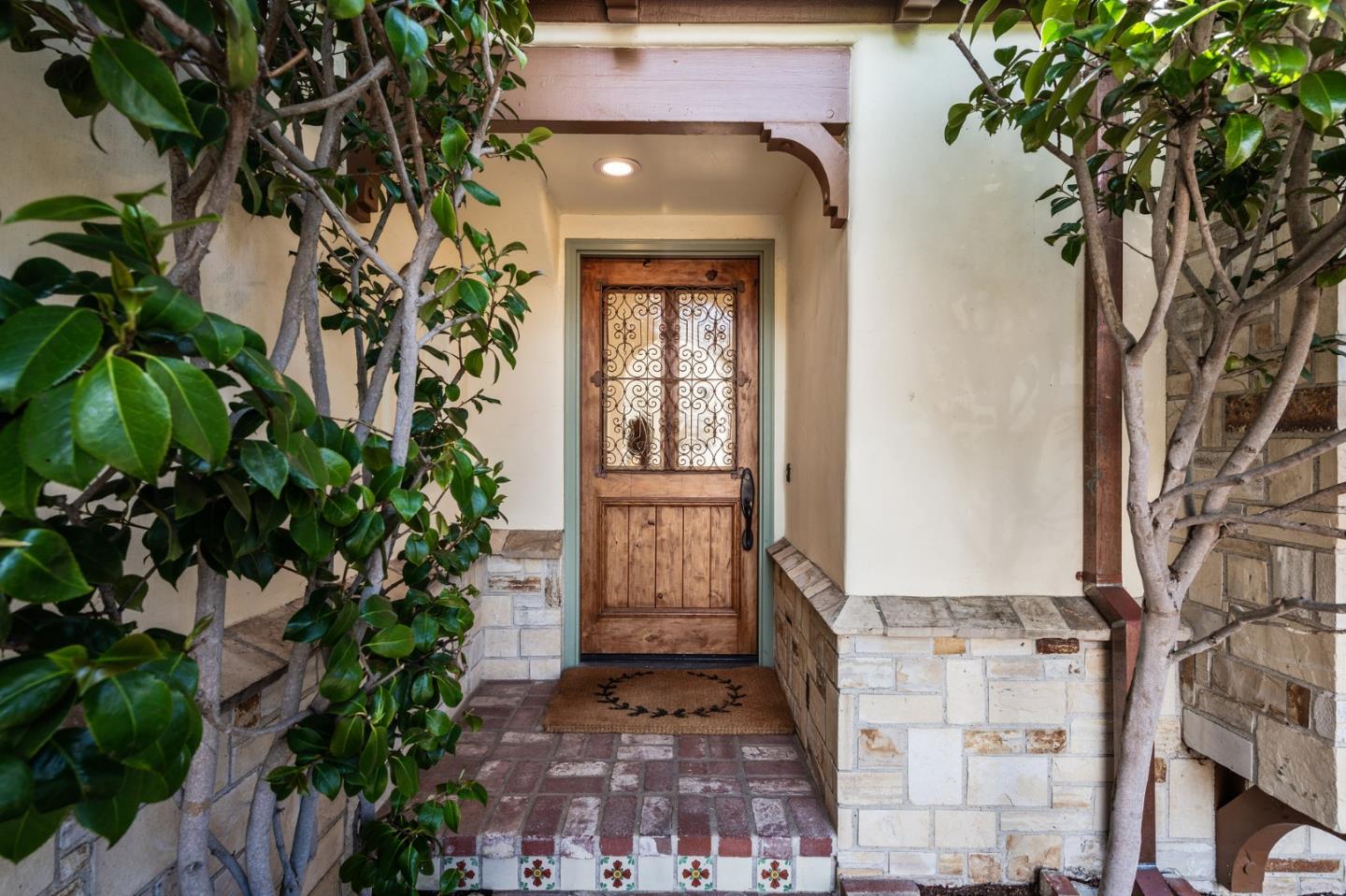 26335 Rio Avenue Carmel, CA 93923 - Photo 6 of 56 a front view of a house with a tree