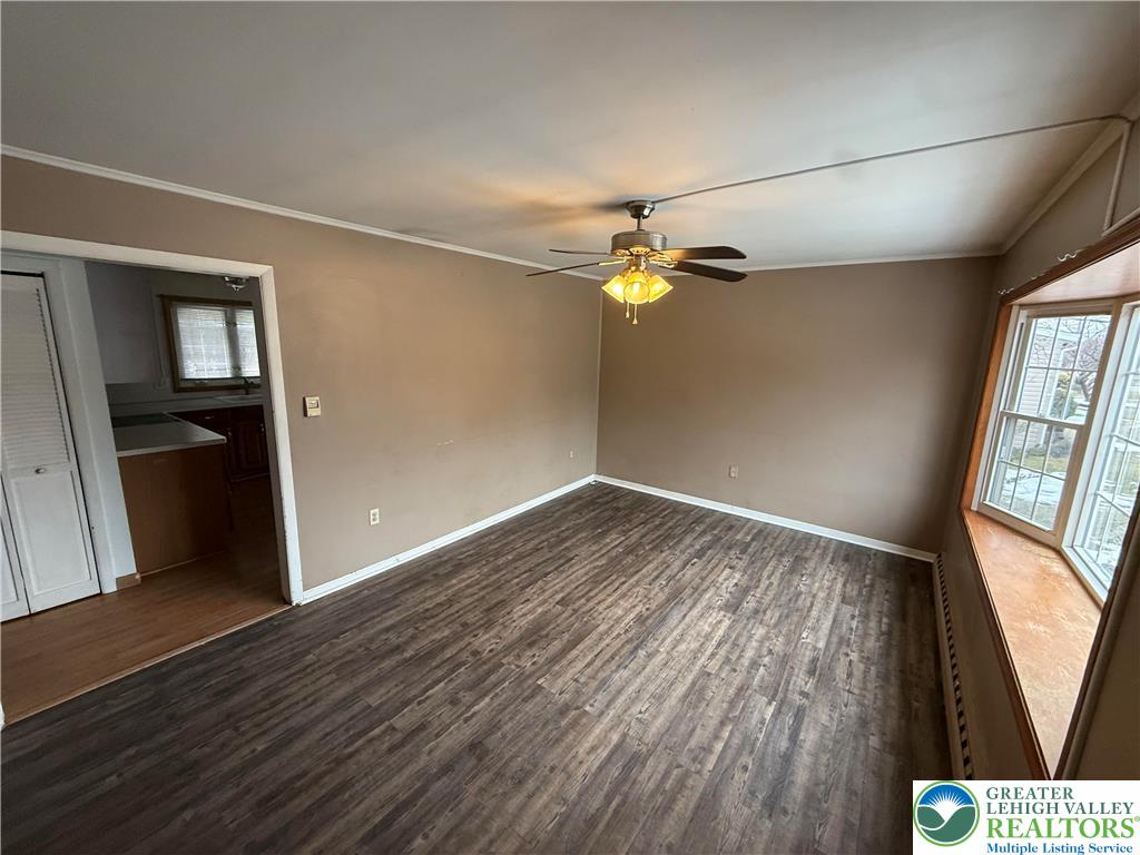 730 East Main Street Weatherly, PA 18255 - Photo 5 of 16 an empty room with wooden floor and windows