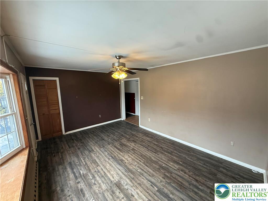 730 East Main Street Weatherly, PA 18255 - Photo 6 of 16 an empty room with wooden floor chandelier fan and windows