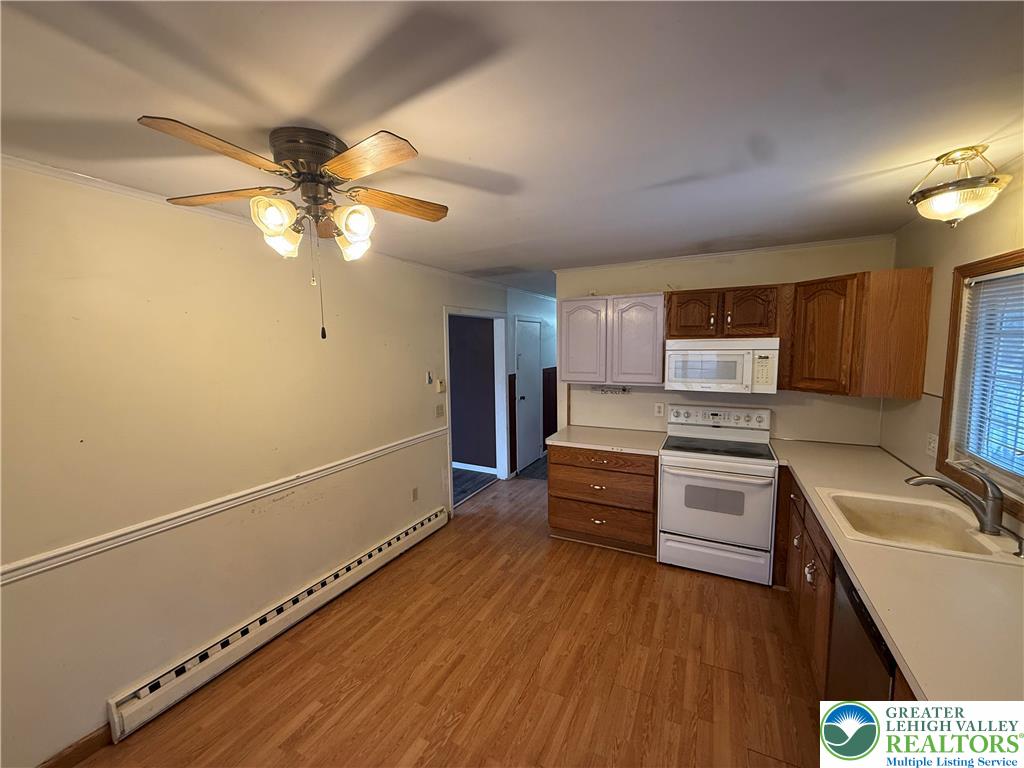 730 East Main Street Weatherly, PA 18255 - Photo 7 of 16 a kitchen with stainless steel appliances a stove a sink and a refrigerator