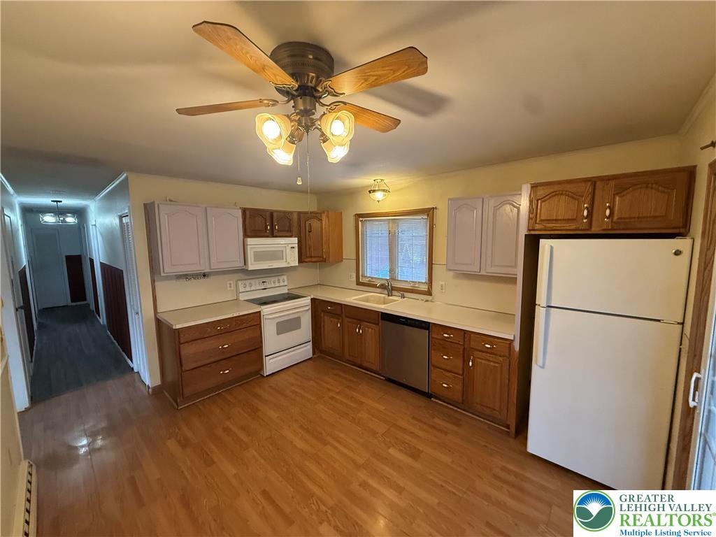 730 East Main Street Weatherly, PA 18255 - Photo 9 of 16 a large kitchen with a refrigerator a sink dishwasher a stove and a refrigerator