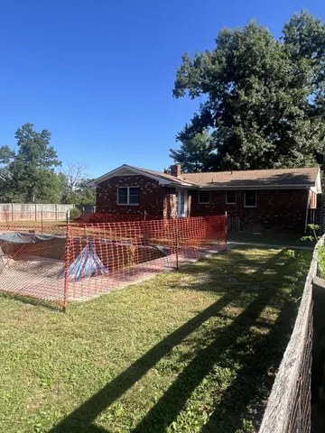 a view of a backyard with a deck