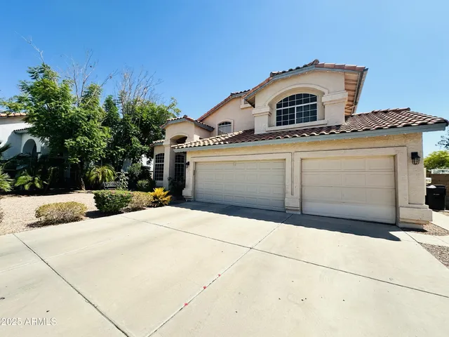 a front view of a house with a garage